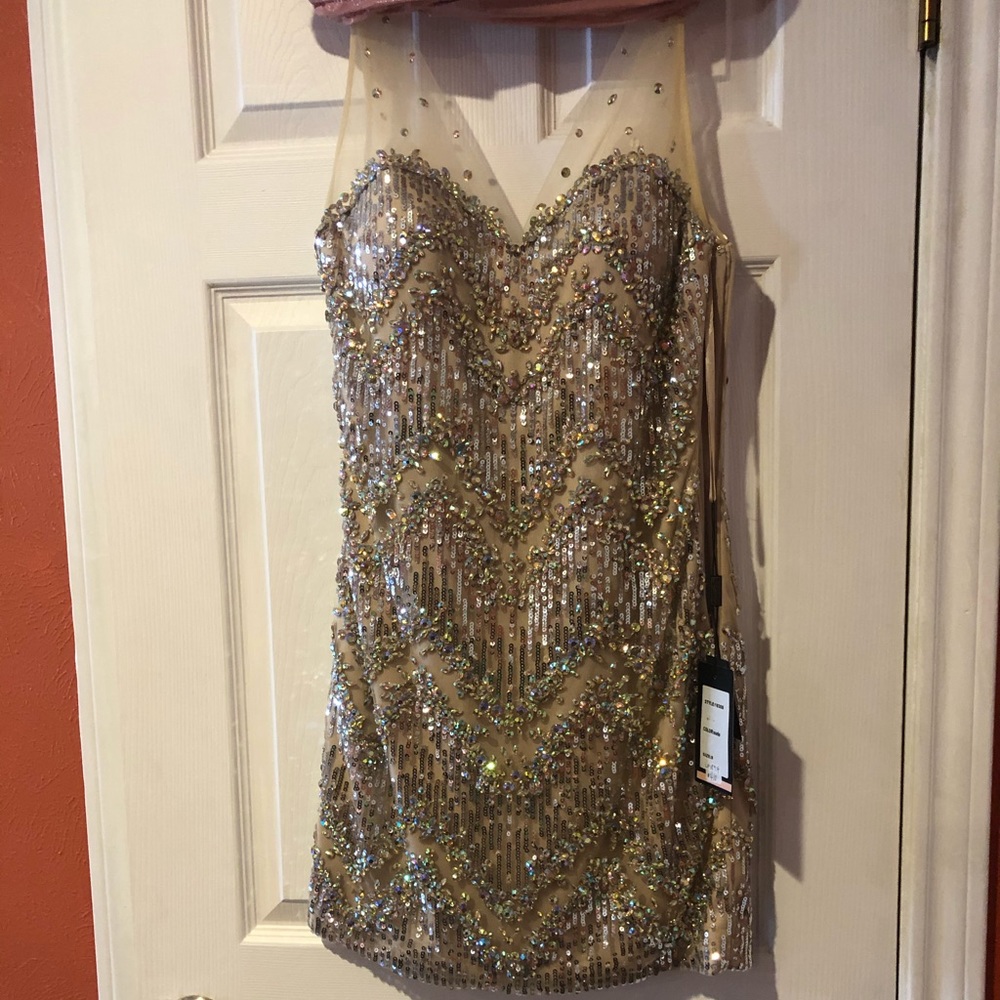 Jeweled nude cocktail dress.
